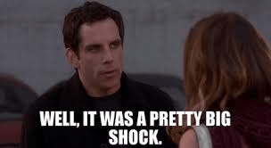 A man with dark hair speaks to a woman, expressing surprise with the text 'WELL, IT WAS A PRETTY BIG SHOCK' displayed.